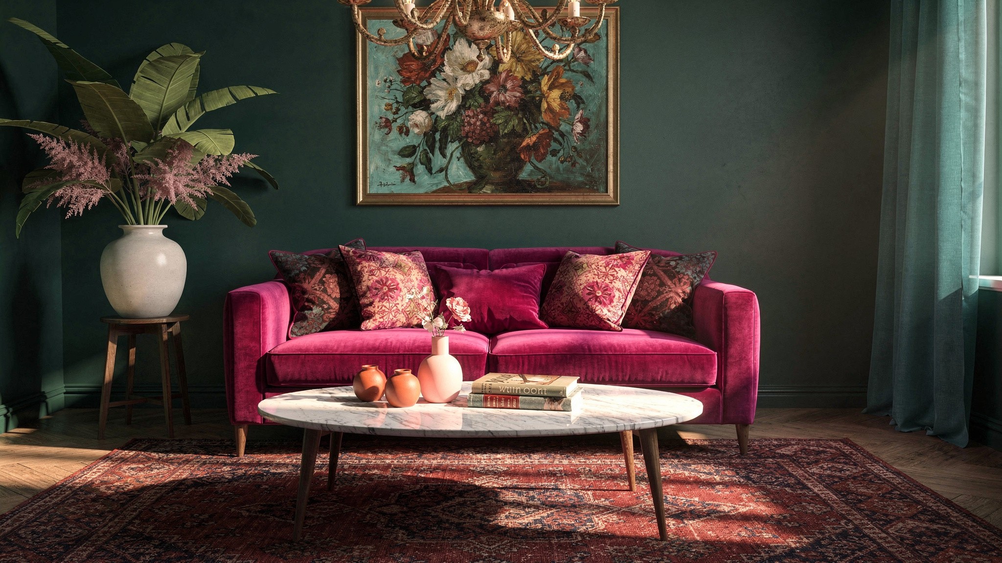 A fuchsia velvet sofa layered with patterned cushions beneath a gold chandelier and a floral still-life painting